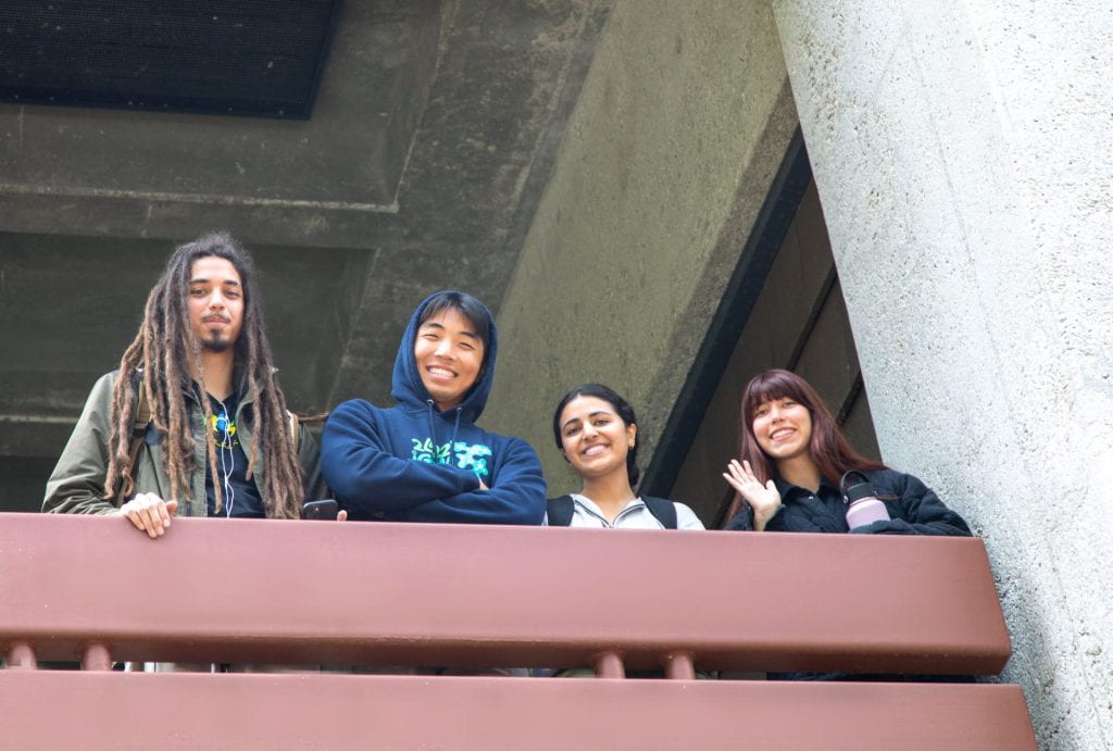 students looking over balcony